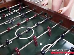 Brooke and Ryan are playing Foosball when they hear a knock at the door, which puts a smile on Brooke's face.