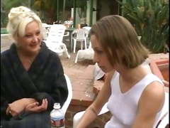 Blonde MILF licks schoolgirl's pussy while schoolgirl fondles her perky tits