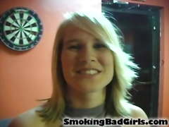 Teen smokes cigarettes while trying on different outfits